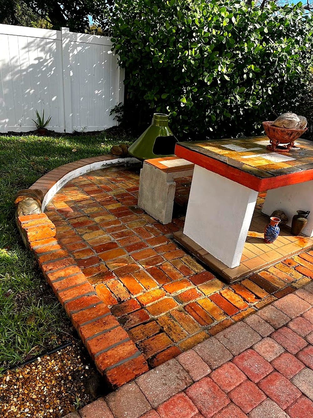 Brick patio revived, pressure washing by Off The Muscle in Palm Beach County