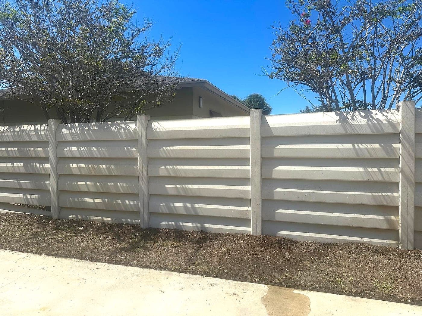 Block wall, cleaned, pressure washing by Off The Muscle in Palm Beach County