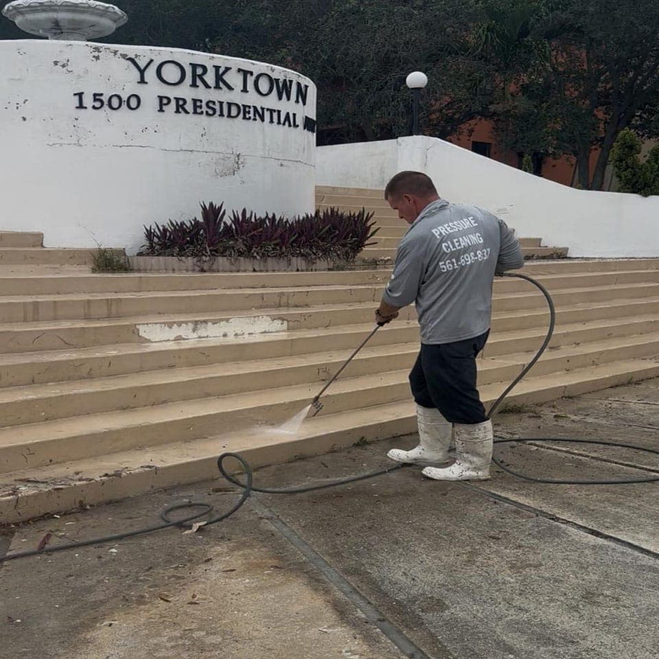 Off The Muscle technician pressure cleaning commercial steps in Palm Beach County