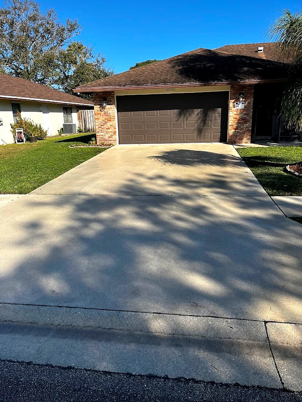The same driveway restored to an even, like-new finish